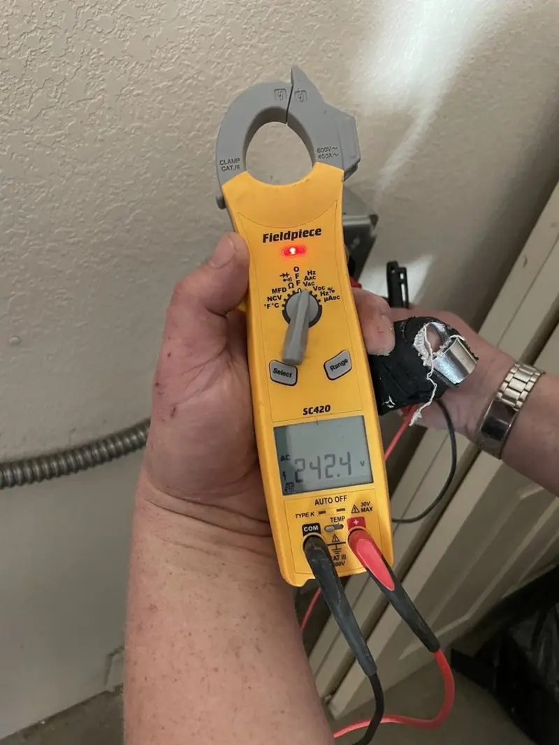Voltage testing with clamp meter during Whole House Surge Protector in Willoughby Hills